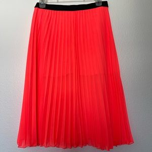 Neon pink pleated skirt